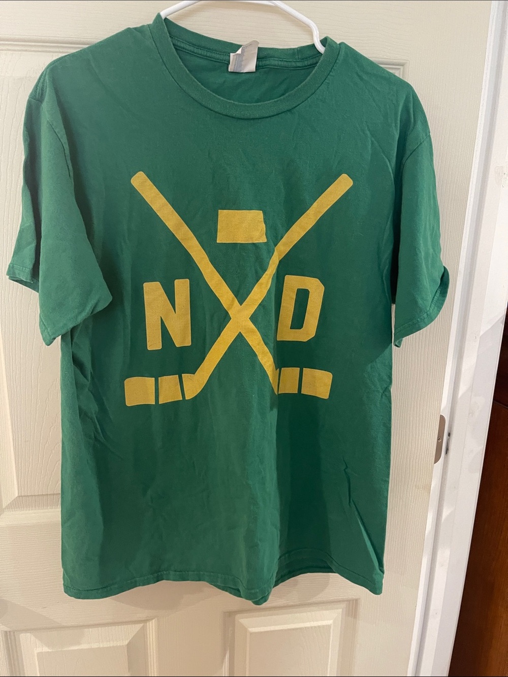 Port and Company Green T-Shirt with Yellow Hockey Graphic